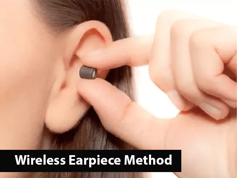 The image shows a woman putting on wireless earpiece to cheat on test The image shows a woman putting on wireless earpiece to cheat on test